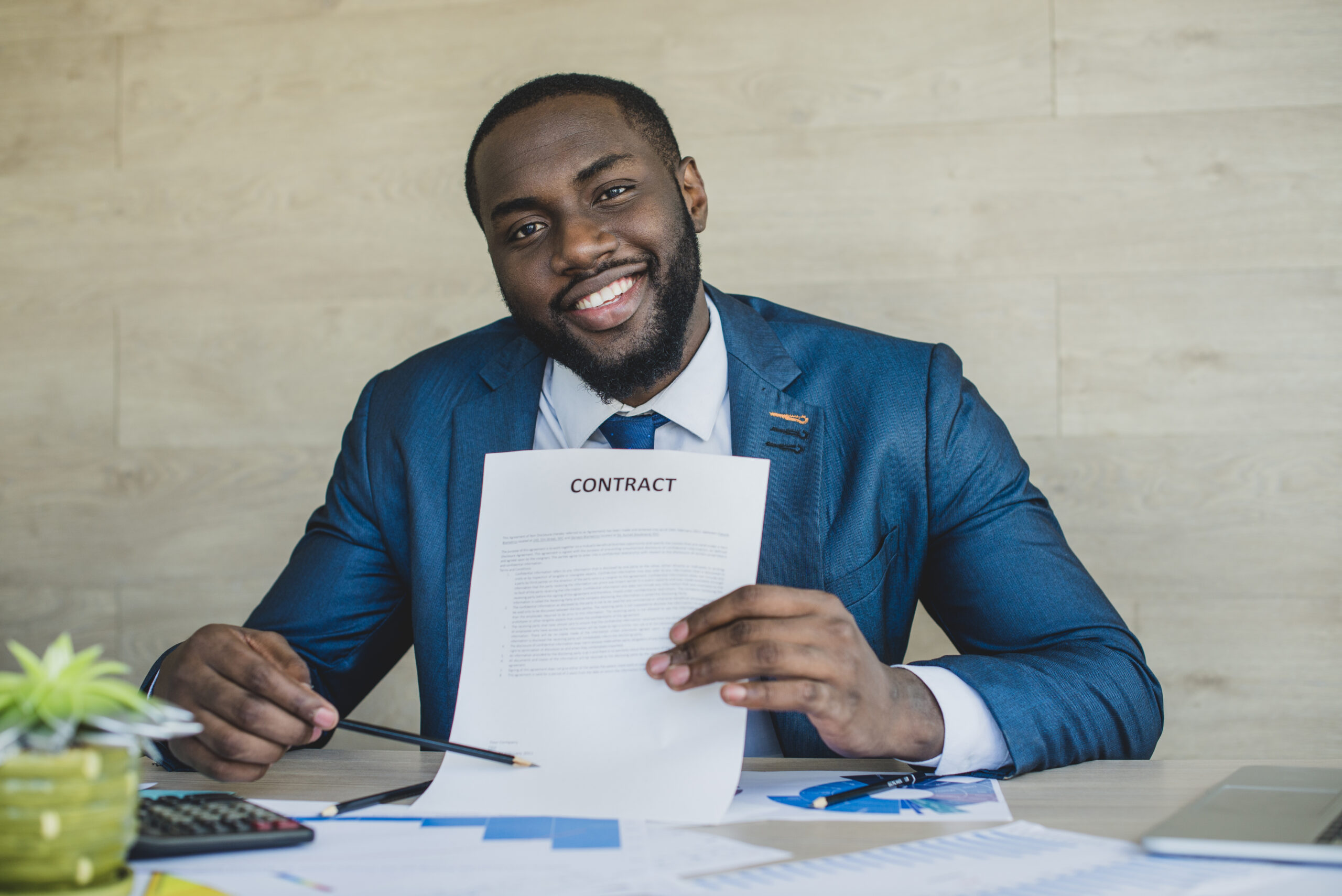 businessman-happy-about-new-contract-scaled